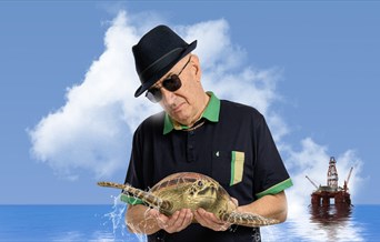 Simon Day is: Dave Angel Eco Warrior Living the Dream Tour