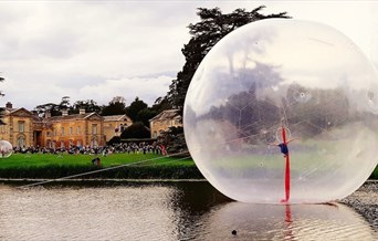 A large inflatable sphere on a lake