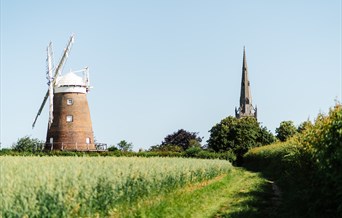 Photo view of church and windmill