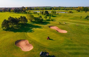 A green keeper looks after the course at Potters Resorts Five Lakes Golf Club