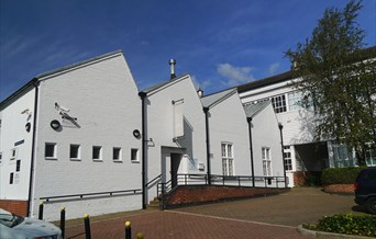 White building with essex weather board which houses Warner Textile Archive in Braintree