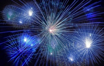 Blue fireworks exploding in the sky