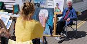 Sue Hodgson demonstrating portraiture at last year's Art on the Quay