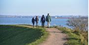 Seawall at Goldhanger with family walking by Paula Freeman