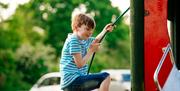 Child climbing on playground area