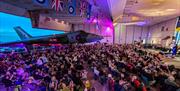 The crowd enjoys the performance at a Proms at the Vulcan event.