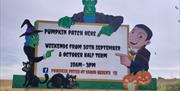 Spooky sign with witch, vampire and Frankenstein monster at Sarah Green's Pumpkin Patch