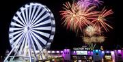 Clacton Pier fireworks and big wheel lit up at night