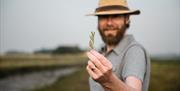 Man holding sea purslane