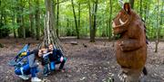 A small boy and his parents on the Gruffalo Trail