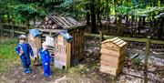 Two boys discovering wildlife at Thorndon Country Park