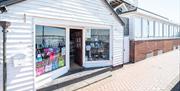 Traditional, white weatherboarded gift shop, Emporium on the Quay