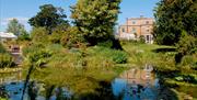 A view over the pond looking at Myddelton House.