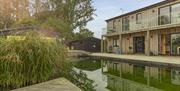 Piglets boutique stay reflected in eco swimming pond