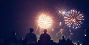 People watching a fireworks display
