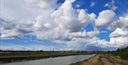 View over the River Crouch with houses in the distance.