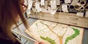 Person viewing the Walker Map of Chelmsford at the Essex Record Office