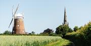 Photo view of church and windmill