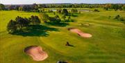 A green keeper looks after the course at Potters Resorts Five Lakes Golf Club