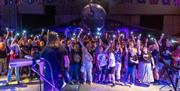 The crowd dances to a rock band at the Music & Beer Festival at the Vulcan.