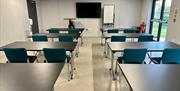 Photograph of a meeting room set up in classroom style.