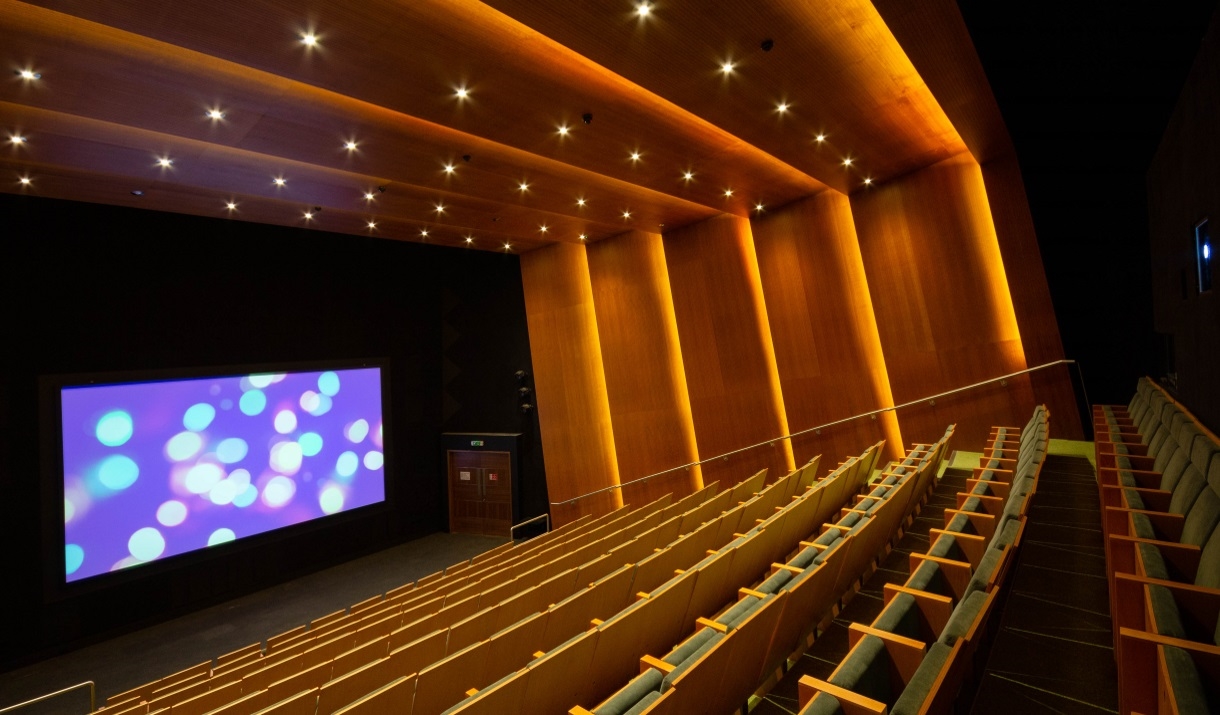 Firstsite cinema, showing rows of theatre style seating leading down to the big screen