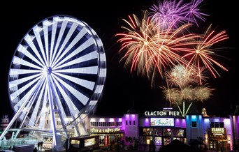 Clacton Pier fireworks and big wheel lit up at night