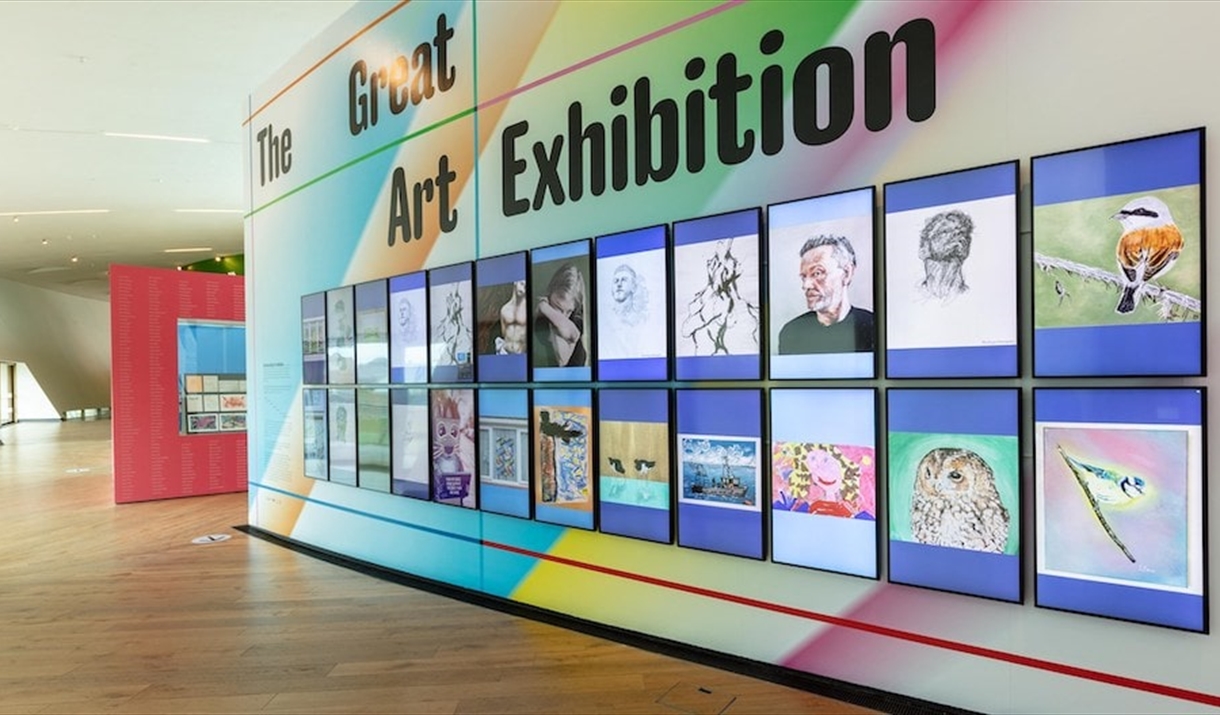 A colourful wall in Firstsite displaying the Great Art Exhibition