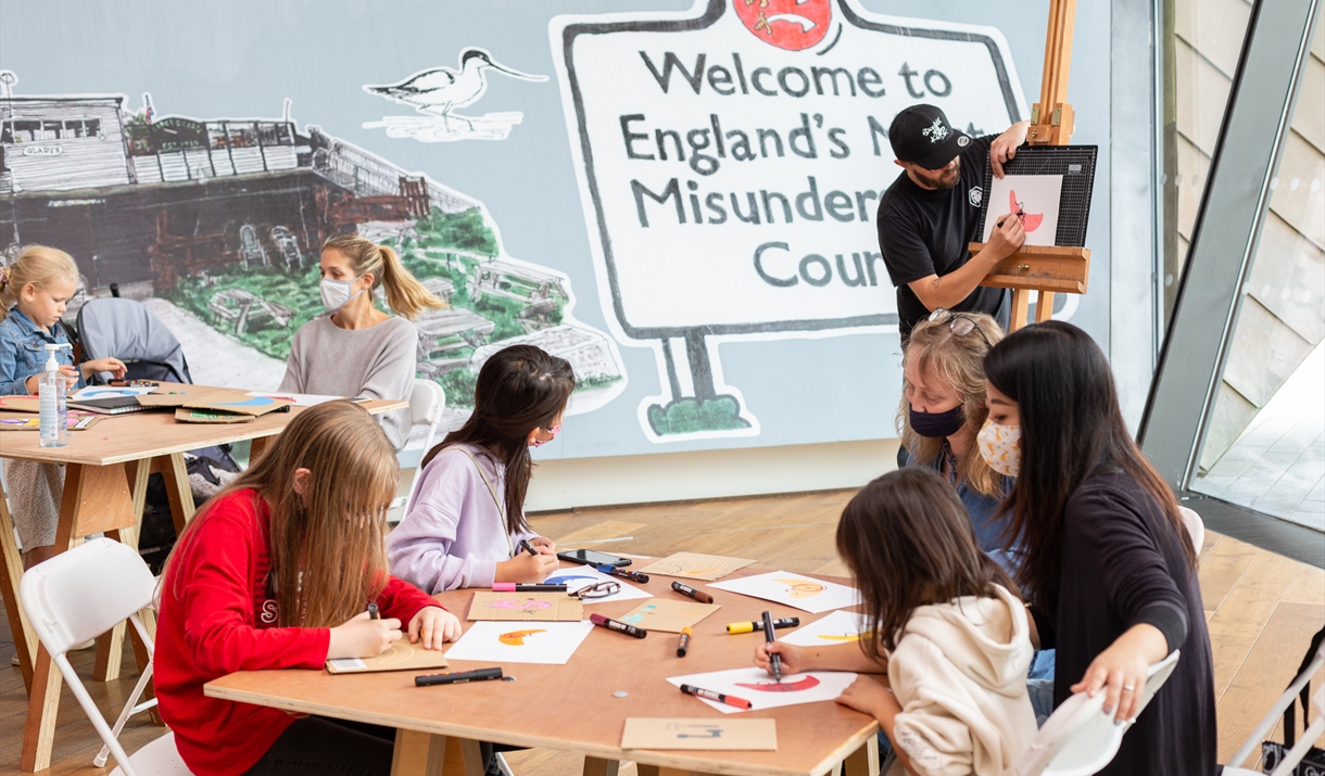 Children doing craft at a table Children doing craft at a table