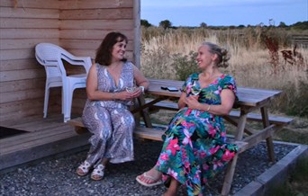 Friends, glampers, holiday, picnic table, seating, glamping pod, Mundon, Maldon, Essex, Bramble Hall Farm, Southey Creek Glamping