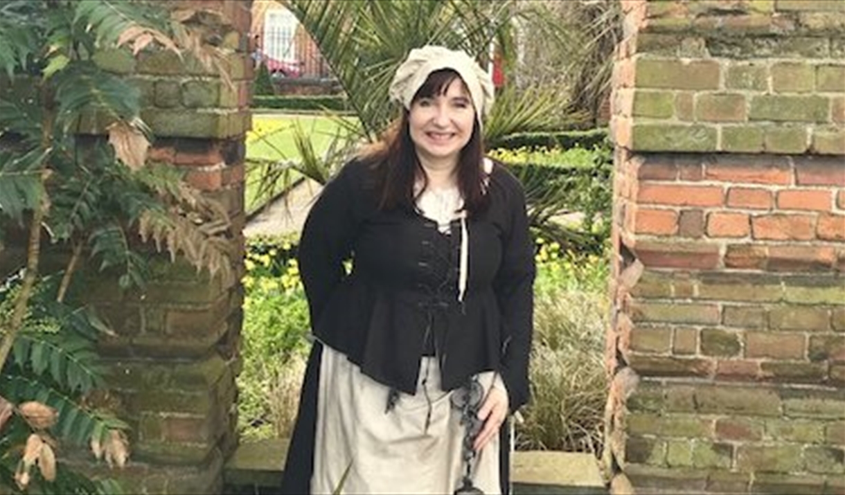 A tour guide in costume as 'the jailer's wife'