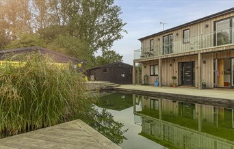 Piglets boutique stay reflected in eco swimming pond