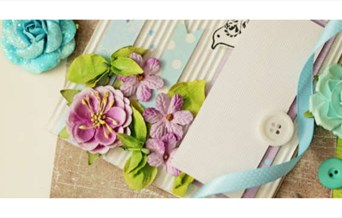 Papercraft flowers, buttons and ribbon