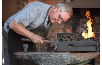 Man working at a forge