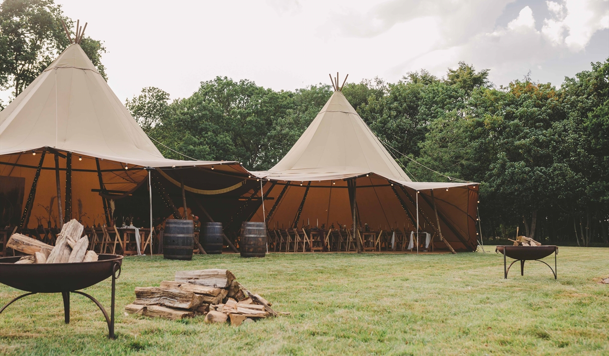 Tipi in secluded meadow