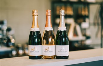 Saffron Grange 2021 wine releases on display - 2018 Classic Cuvée, 2018 Seyval Blanc and 2019 Sparkling Rosé.