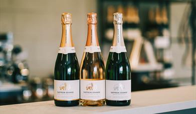 Saffron Grange 2021 wine releases on display - 2018 Classic Cuvée, 2018 Seyval Blanc and 2019 Sparkling Rosé.