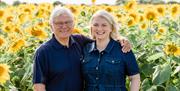 Ralph Metson and Jo Pike, the father and daughter team behind Writtle Sunflowers, standing in their sunflower field.