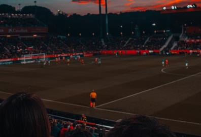 Football game at sunset in stadium