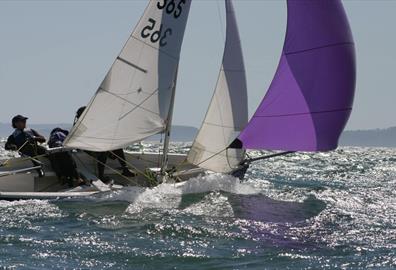 Sailboat with people on the water