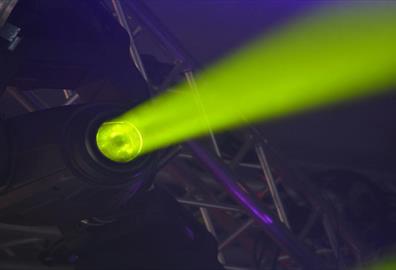 Close-up of green spotlight and stage-lighting rig