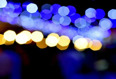 Abstract bokeh photo capturing blue and orange lights