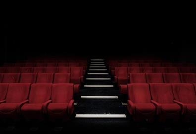 Empty red seats in a theatre