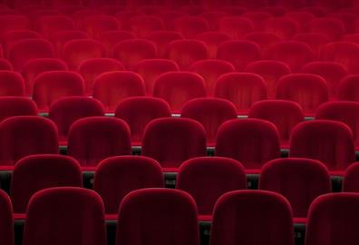 Empty red seats in a theatre