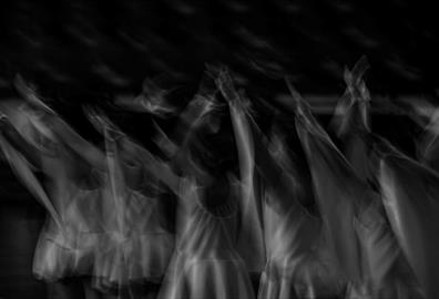 Black and white image capturing dancers in motion