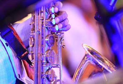 A close up of a golden saxophone