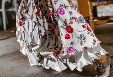 White dress with ruffles and bright flowers