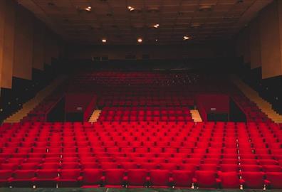 Empty red seats in a theatre