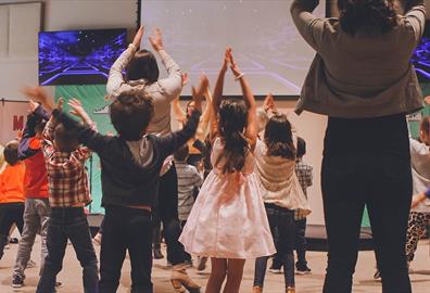 Kids participating in a theatre workshop
