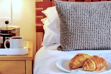 Bedside table - coffee and croissants